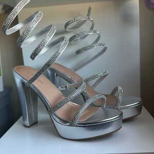 Silver heels worn once for pictures. Size 7 women’s
